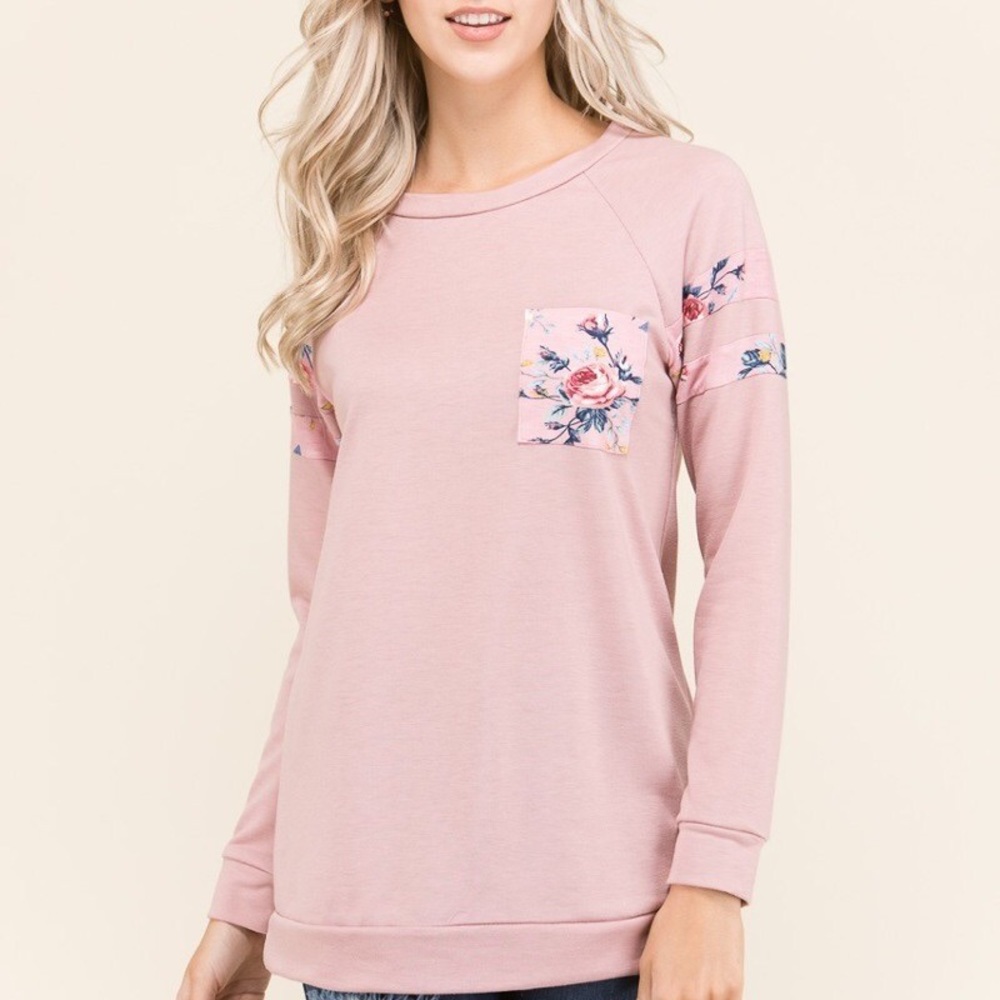 Pink sweater with floral accents
